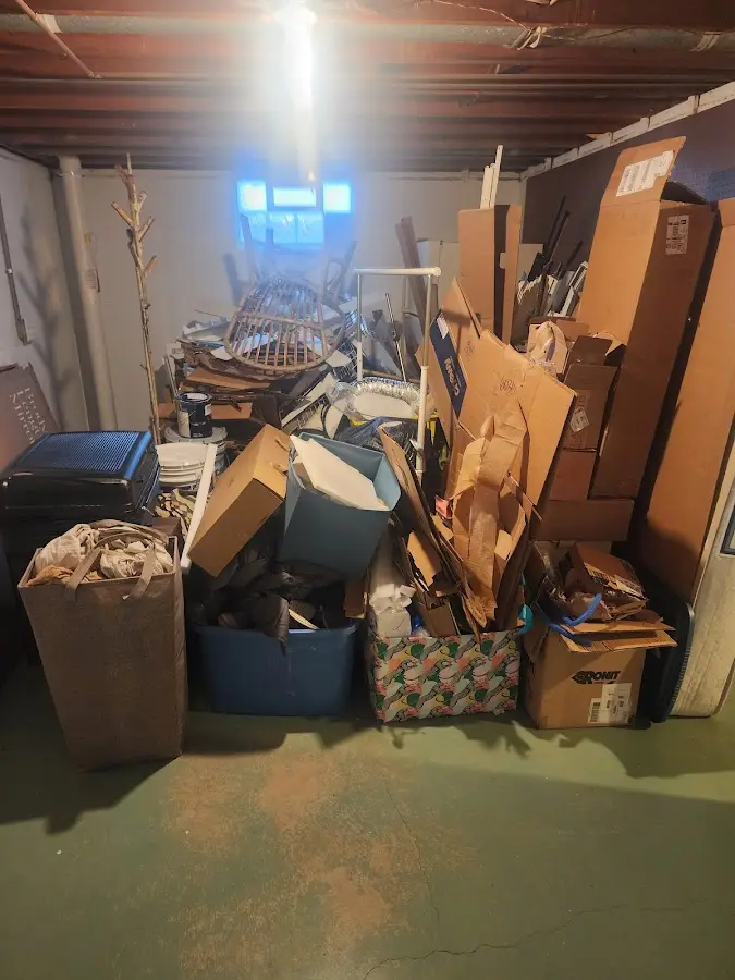 Roll-off dumpster container at job site for Yard Waste Dumpster Rental in West Greenwich